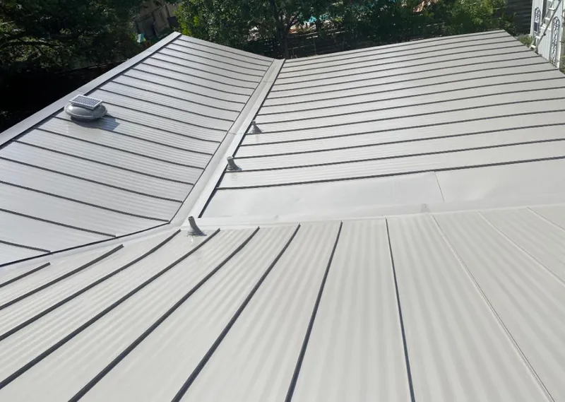 Solar attic fan installed on a metal roof for Roof Ventilation in Brownwood
